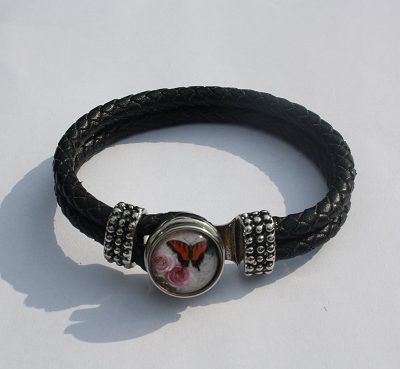 Armband met vlinder drukknoop zwart